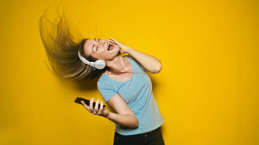 Girl listening song on headphone